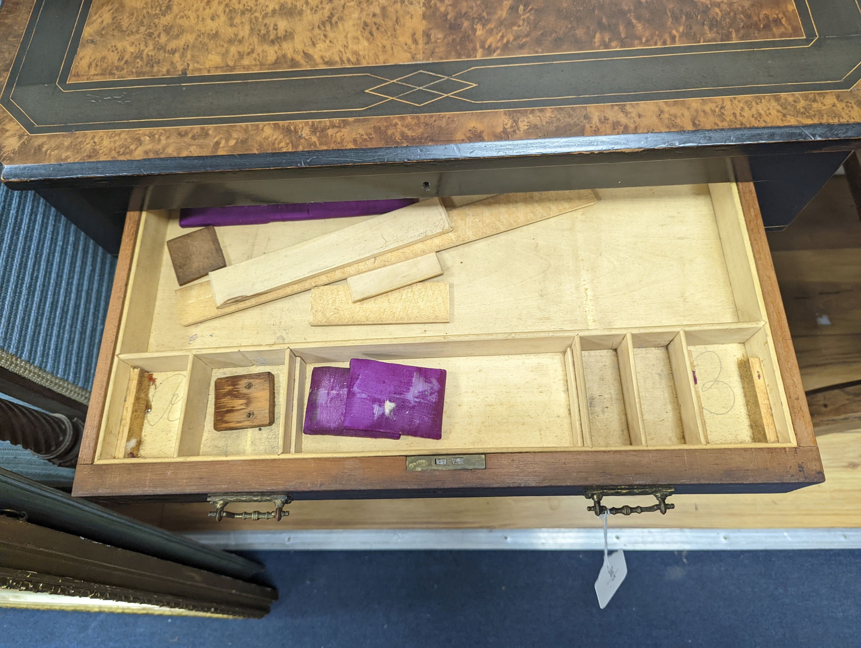 A late Victorian part ebonised bird's eye maple writing/work table, width 67cm, depth 41cm, height 69cm